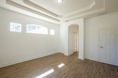 Beautiful 4-bedroom, 3-bathroom home on an oversized lot in on The Grand Club Cypress Course in Florida - for sale on GolfHomes.com, golf home, golf lot