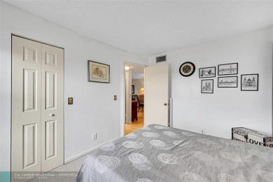 Beautiful, turn key, top corner condo, fully furnished located on Sunrise Lakes Phase III in Florida - for sale on GolfHomes.com, golf home, golf lot