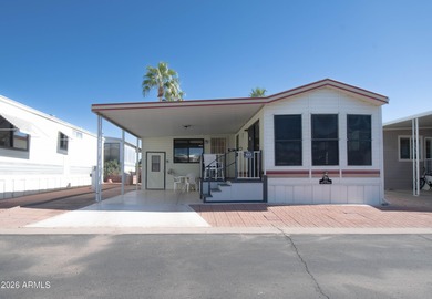 This cute home is located in Carriage Manor Resort, a premier on Fountain of the Sun Country Club in Arizona - for sale on GolfHomes.com, golf home, golf lot