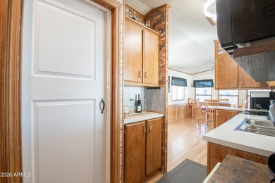 This cute home is located in Carriage Manor Resort, a premier on Fountain of the Sun Country Club in Arizona - for sale on GolfHomes.com, golf home, golf lot