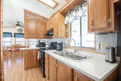 This cute home is located in Carriage Manor Resort, a premier on Fountain of the Sun Country Club in Arizona - for sale on GolfHomes.com, golf home, golf lot