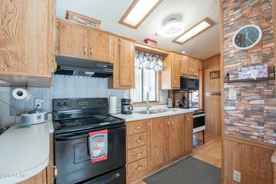 This cute home is located in Carriage Manor Resort, a premier on Fountain of the Sun Country Club in Arizona - for sale on GolfHomes.com, golf home, golf lot