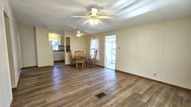 Welcome to your perfect retirement oasis in the charming city of on Herons Glen Golf and Country Club in Florida - for sale on GolfHomes.com, golf home, golf lot
