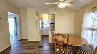 Welcome to your perfect retirement oasis in the charming city of on Herons Glen Golf and Country Club in Florida - for sale on GolfHomes.com, golf home, golf lot