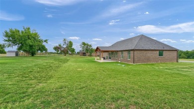 Located near the charming city of Denison, TX, 31 Golf Walk Cir on Denison Country Club in Texas - for sale on GolfHomes.com, golf home, golf lot