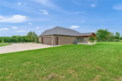 Located near the charming city of Denison, TX, 31 Golf Walk Cir on Denison Country Club in Texas - for sale on GolfHomes.com, golf home, golf lot