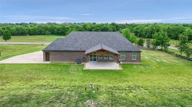 Located near the charming city of Denison, TX, 31 Golf Walk Cir on Denison Country Club in Texas - for sale on GolfHomes.com, golf home, golf lot