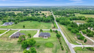 Located near the charming city of Denison, TX, 31 Golf Walk Cir on Denison Country Club in Texas - for sale on GolfHomes.com, golf home, golf lot