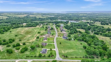 Located near the charming city of Denison, TX, 31 Golf Walk Cir on Denison Country Club in Texas - for sale on GolfHomes.com, golf home, golf lot