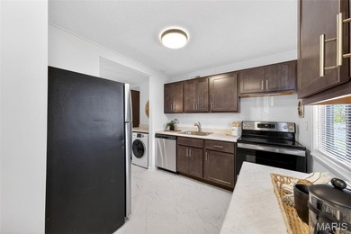 Live like you're on vacation every day in this completely on Lake Saint Louis Par 3 in Missouri - for sale on GolfHomes.com, golf home, golf lot