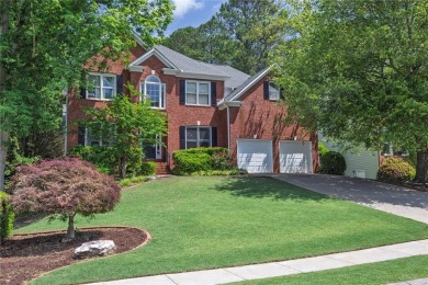 Perfectly positioned on the fairway of the par-5 2nd hole in the on Towne Lake Hills Golf Club in Georgia - for sale on GolfHomes.com, golf home, golf lot