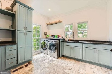 Set on a beautifully manicured 3/4-acre lot in East Cobb's on Atlanta Country Club in Georgia - for sale on GolfHomes.com, golf home, golf lot
