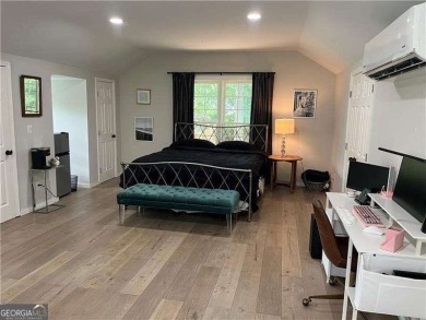 Set on a beautifully manicured 3/4-acre lot in East Cobb's on Atlanta Country Club in Georgia - for sale on GolfHomes.com, golf home, golf lot