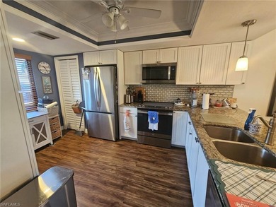 Beautifully updated 1st floor end unit with fantastic lake and on Countryside Golf and Country Club in Florida - for sale on GolfHomes.com, golf home, golf lot