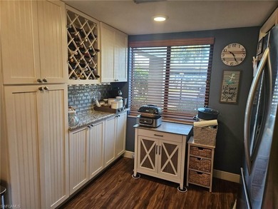 Beautifully updated 1st floor end unit with fantastic lake and on Countryside Golf and Country Club in Florida - for sale on GolfHomes.com, golf home, golf lot