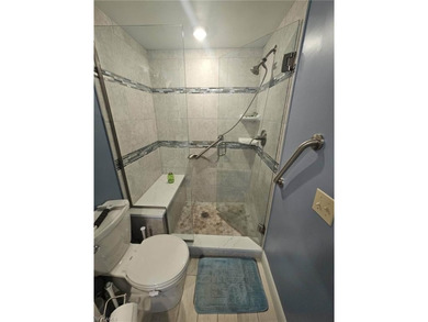 Beautifully updated 1st floor end unit with fantastic lake and on Countryside Golf and Country Club in Florida - for sale on GolfHomes.com, golf home, golf lot