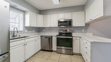 COME to SUNNY FLORIDA! Welcome to resort-style living in the on Tampa Bay Golf and Country Club in Florida - for sale on GolfHomes.com, golf home, golf lot