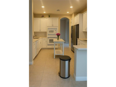 HEATED POOL & SPA WITH CASCADING WATERFALL! Welcome to Belle on Estero Country Club in Florida - for sale on GolfHomes.com, golf home, golf lot