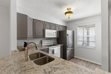 Charming 1-Bedroom End Unit Condo for 55+ buyers with access to on Highland Lakes Executive Golf Course in Florida - for sale on GolfHomes.com, golf home, golf lot