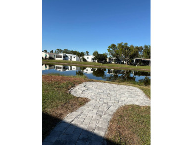 The thought of spending your retirement years gazing at this on Sabal Springs Golf and Racquet Club in Florida - for sale on GolfHomes.com, golf home, golf lot