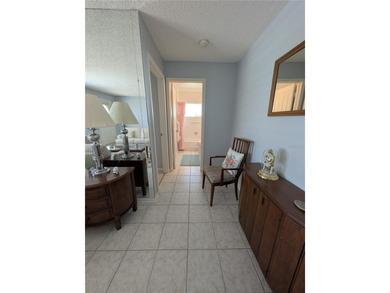 Immaculate *PHILODENDRON* w/private backyard, centrally located on Mainlands Golf Club in Florida - for sale on GolfHomes.com, golf home, golf lot