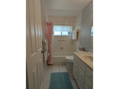 Immaculate *PHILODENDRON* w/private backyard, centrally located on Mainlands Golf Club in Florida - for sale on GolfHomes.com, golf home, golf lot