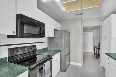 One or more photo(s) has been virtually staged. Step into this on Feather Sound Country Club in Florida - for sale on GolfHomes.com, golf home, golf lot