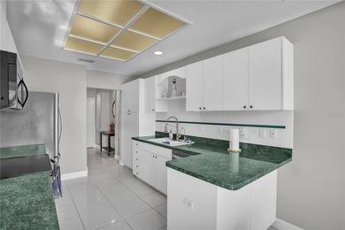 One or more photo(s) has been virtually staged. Step into this on Feather Sound Country Club in Florida - for sale on GolfHomes.com, golf home, golf lot