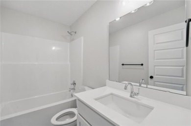 This bright and comfortable three-bedroom, two-bathroom ranch on Golf Club of Creekmoor in Missouri - for sale on GolfHomes.com, golf home, golf lot