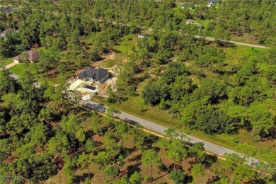 Exclusively listed by Sunland Real Estate: This prime 0.50-acre on Lehigh Resort Club in Florida - for sale on GolfHomes.com, golf home, golf lot
