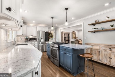 Nestled on a large 3/4+ acre serene, corner lot in the highly on Bobby Jones Golf Club in Georgia - for sale on GolfHomes.com, golf home, golf lot