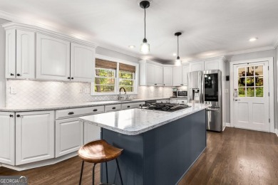 Nestled on a large 3/4+ acre serene, corner lot in the highly on Bobby Jones Golf Club in Georgia - for sale on GolfHomes.com, golf home, golf lot