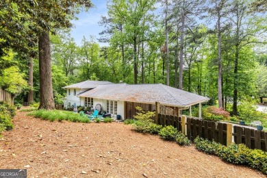 Nestled on a large 3/4+ acre serene, corner lot in the highly on Bobby Jones Golf Club in Georgia - for sale on GolfHomes.com, golf home, golf lot