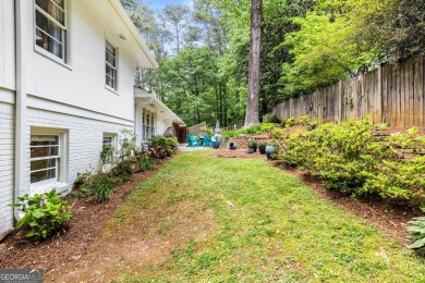 Nestled on a large 3/4+ acre serene, corner lot in the highly on Bobby Jones Golf Club in Georgia - for sale on GolfHomes.com, golf home, golf lot