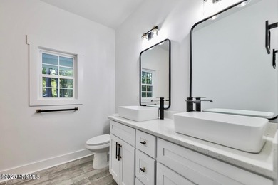 Discover a home that flawlessly blends modern sophistication on Carolina Shores Golf Course in North Carolina - for sale on GolfHomes.com, golf home, golf lot