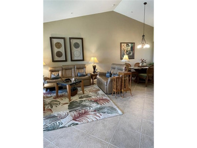 Nestled alongside the Flamingo Island Golf Course, this on Lely Resort Golf and Country Club in Florida - for sale on GolfHomes.com, golf home, golf lot