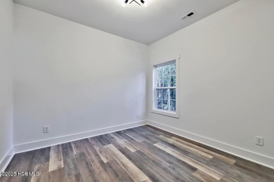 Discover a home that flawlessly blends modern sophistication on Carolina Shores Golf Course in North Carolina - for sale on GolfHomes.com, golf home, golf lot