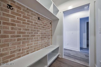 Discover a home that flawlessly blends modern sophistication on Carolina Shores Golf Course in North Carolina - for sale on GolfHomes.com, golf home, golf lot