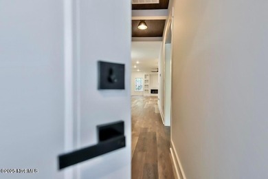 Discover a home that flawlessly blends modern sophistication on Carolina Shores Golf Course in North Carolina - for sale on GolfHomes.com, golf home, golf lot