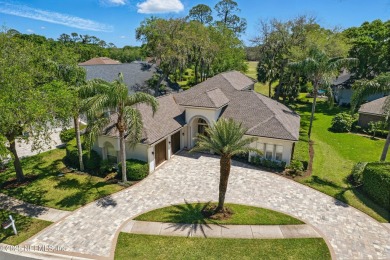 Nestled beneath a canopy of mature oak trees in the gated on Queens Harbour Yacht and Country Club in Florida - for sale on GolfHomes.com, golf home, golf lot