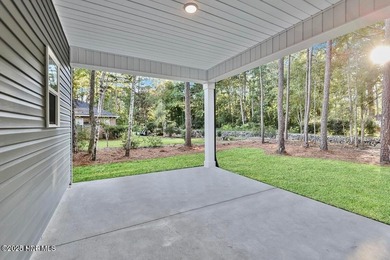 Discover a home that flawlessly blends modern sophistication on Carolina Shores Golf Course in North Carolina - for sale on GolfHomes.com, golf home, golf lot