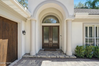 Nestled beneath a canopy of mature oak trees in the gated on Queens Harbour Yacht and Country Club in Florida - for sale on GolfHomes.com, golf home, golf lot