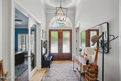 Nestled beneath a canopy of mature oak trees in the gated on Queens Harbour Yacht and Country Club in Florida - for sale on GolfHomes.com, golf home, golf lot