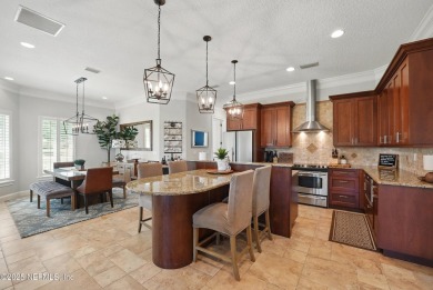 Nestled beneath a canopy of mature oak trees in the gated on Queens Harbour Yacht and Country Club in Florida - for sale on GolfHomes.com, golf home, golf lot