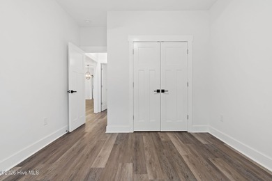 Discover a home that flawlessly blends modern sophistication on Carolina Shores Golf Course in North Carolina - for sale on GolfHomes.com, golf home, golf lot