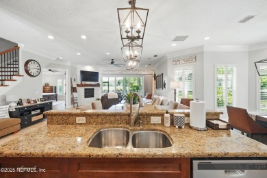 Nestled beneath a canopy of mature oak trees in the gated on Queens Harbour Yacht and Country Club in Florida - for sale on GolfHomes.com, golf home, golf lot