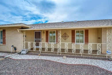 This charming 2 bedroom, 2 bath home has a bright living room on Sun City Lakes West and East in Arizona - for sale on GolfHomes.com, golf home, golf lot
