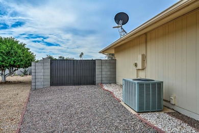 This charming 2 bedroom, 2 bath home has a bright living room on Sun City Lakes West and East in Arizona - for sale on GolfHomes.com, golf home, golf lot