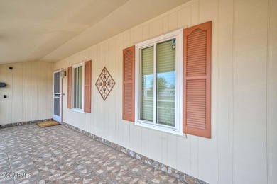 This charming 2 bedroom, 2 bath home has a bright living room on Sun City Lakes West and East in Arizona - for sale on GolfHomes.com, golf home, golf lot