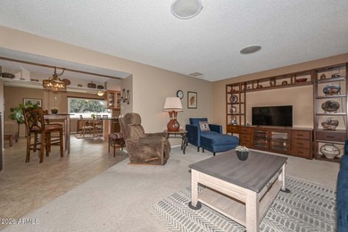 This charming 2 bedroom, 2 bath home has a bright living room on Sun City Lakes West and East in Arizona - for sale on GolfHomes.com, golf home, golf lot
